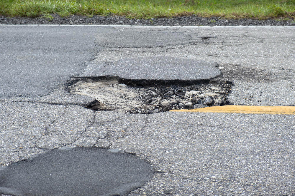 How to Deal with Potholes: A Guide to Keeping Your Asphalt Safe and Smooth