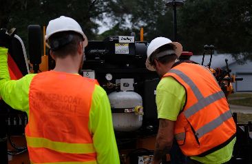 Florida Sealcoating team operating equipment
