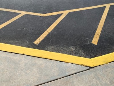 Freshly painted parking lot striping lines on asphalt