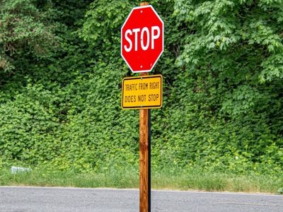 Parking lot traffic signs including stop signs and regulatory signage