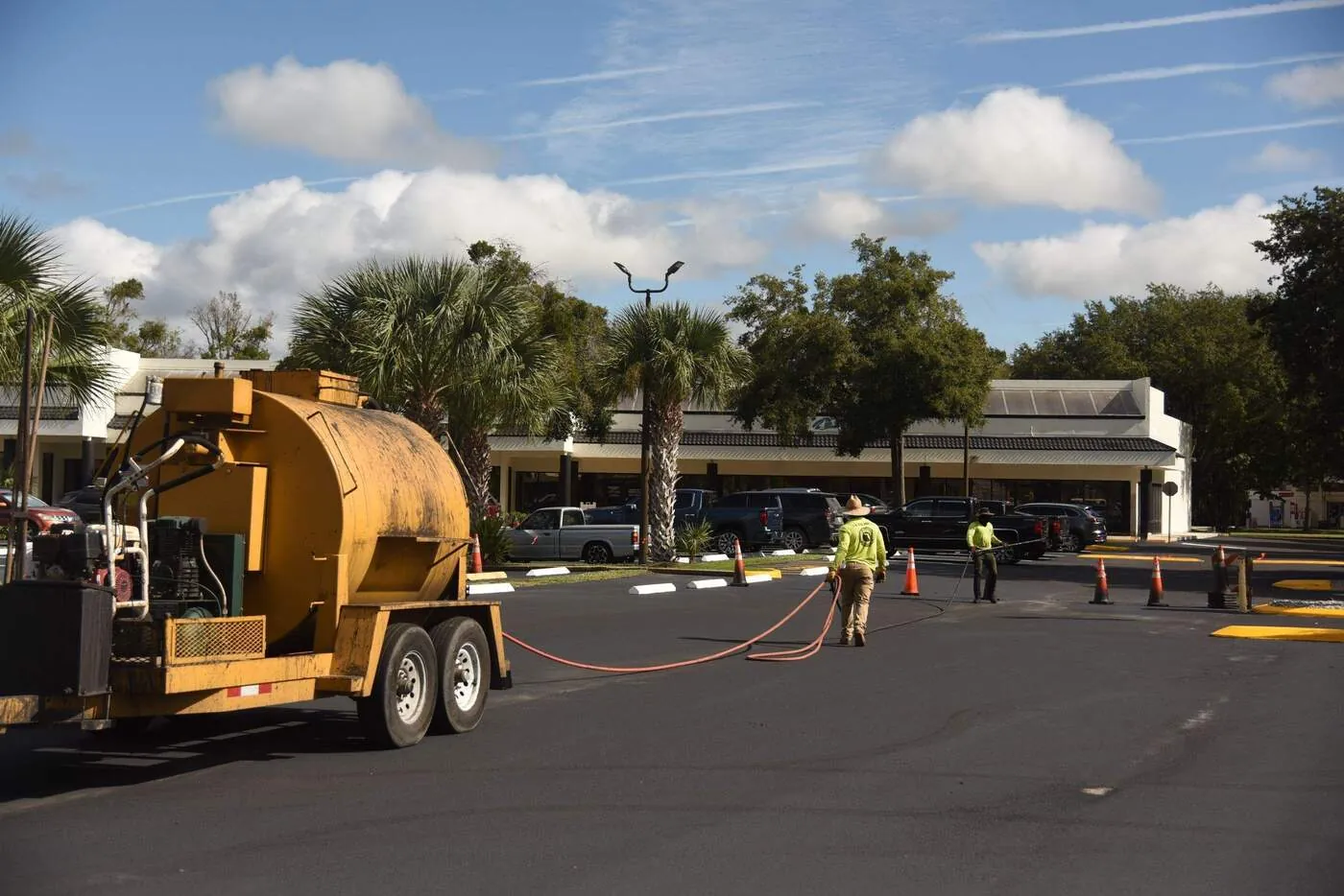 Even, uniform sealcoat finish on a commercial parking lot after application