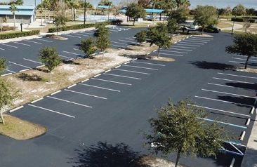Parking lot asphalt sealcoating